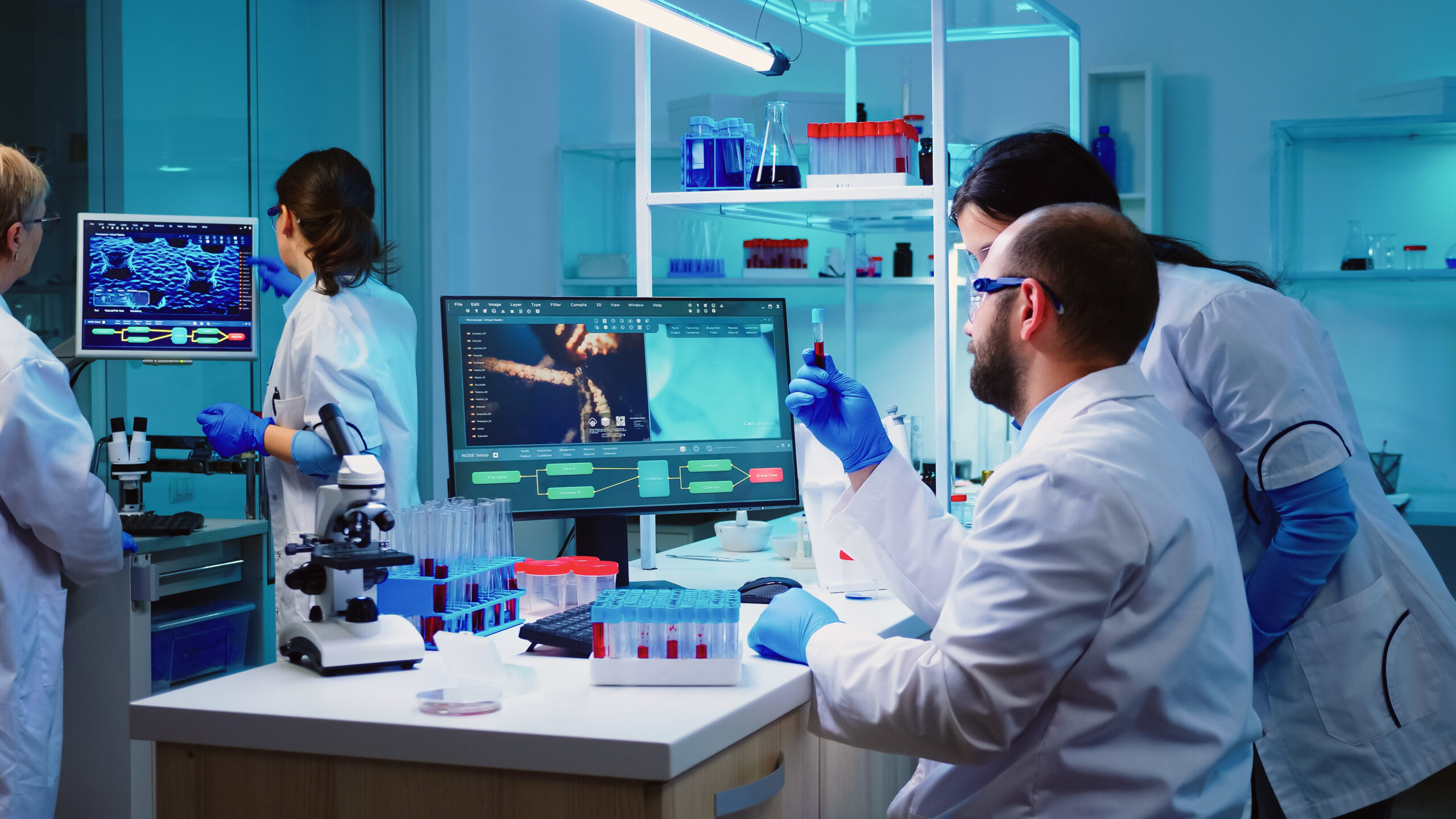 microbiologist doctor taking blood sample tube from rack with machines analysis lab background scaled